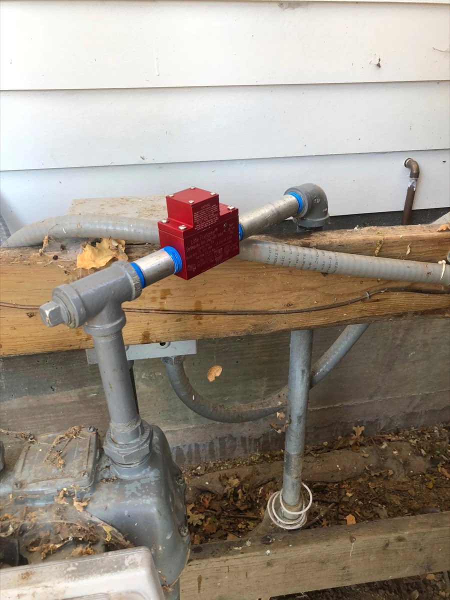 Gas line and meter manifold with earthquake shutoff valve